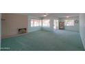 Spacious living room with fireplace and water view at 4906 E Lake Point Cir, Phoenix, AZ 85044