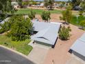 House exterior and driveway, near golf course and lake at 4906 E Lake Point Cir, Phoenix, AZ 85044