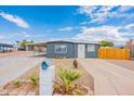 Ranch style home with carport and gravel driveway at 9472 E Escondido Ave, Mesa, AZ 85208