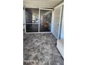 Screened porch with stone-look tile flooring and patio furniture at 2233 E Behrend Dr # 41, Phoenix, AZ 85024