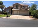 Two-story house with a three-car garage and landscaping at 21956 N 59Th Ln, Glendale, AZ 85310