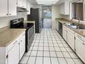 Bright kitchen with stainless steel appliances and white cabinets at 1930 S Westwood -- # 23, Mesa, AZ 85210