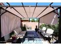 Relaxing covered patio with seating area, perfect for outdoor entertaining at 215 S 16Th St, Coolidge, AZ 85128