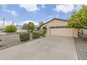 House exterior featuring a gravel driveway and a two-car garage at 9626 N 35Th Ln, Phoenix, AZ 85051