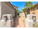 Landscaped entryway with a stone bench and pathway at 7705 E Doubletree Ranch Rd # 28, Scottsdale, AZ 85258