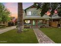 Charming two-story house with a brick front and porch at 73 W Lewis Ave, Phoenix, AZ 85003