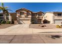 Two-story house with a two-car garage and desert landscaping at 2104 E 36Th Ave, Apache Junction, AZ 85119