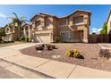 Two-story house with a two-car garage and gravel landscaping at 2104 E 36Th Ave, Apache Junction, AZ 85119