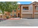Two-story townhome with attached garage and landscaping at 14575 W Mountain View Blvd # 221, Surprise, AZ 85374