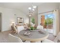 Dining area with table and chairs, leading to patio at 14575 W Mountain View Blvd # 221, Surprise, AZ 85374