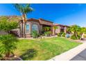 Stunning curb appeal, lush landscaping, and mountain views at 9845 E Inglewood St, Mesa, AZ 85207