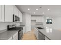 Modern kitchen with gray countertops and stainless steel appliances at 1521 W Saddle Run, Apache Junction, AZ 85120