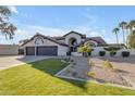 Three-car garage and expansive front yard at 12222 N 74Th St, Scottsdale, AZ 85260