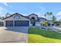 Stunning curb appeal, three-car garage, and lush lawn at 12222 N 74Th St, Scottsdale, AZ 85260