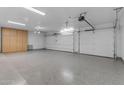 Two-car garage with epoxy flooring and ample storage at 12222 N 74Th St, Scottsdale, AZ 85260