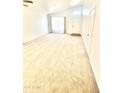 Bright and spacious living room with neutral carpet and large windows at 1639 E Redfield Rd, Gilbert, AZ 85234