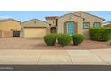 Beautiful one-story home with a two-car garage and well-manicured landscaping at 18172 W Devonshire Ave, Goodyear, AZ 85395