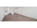 Living room with wood-look flooring and kitchen at 611 N 13Th Pl, Coolidge, AZ 85128