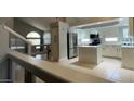 Modern kitchen featuring white cabinets, an island, and stainless steel appliances at 427 E Mayfield Dr, San Tan Valley, AZ 85143