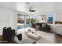 Bright living room with sliding glass doors leading to the backyard at 18212 W Illini St, Goodyear, AZ 85338