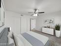 Bright bedroom with double door closet and ceiling fan at 2711 N Olympic Cir, Mesa, AZ 85215