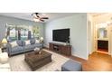 Comfortable living room with hardwood floors and ample natural light at 14300 W Bell Rd # 35, Surprise, AZ 85374