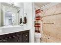 Updated bathroom with a walk-in shower and modern vanity at 14300 W Bell Rd # 35, Surprise, AZ 85374