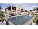 Resort-style pool with lounge chairs and umbrellas at 9130 N Hummingbird Trl, Fountain Hills, AZ 85268