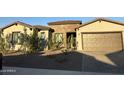 Modern home exterior with two-car garage and landscaping at 7537 N 83Rd Dr, Glendale, AZ 85305