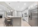Open kitchen with an island and stainless steel appliances at 32029 N 20Th Ln, Phoenix, AZ 85085
