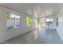 Bright sunroom with tile flooring and access to the backyard at 2650 W Union Hills Dr # 236, Phoenix, AZ 85027
