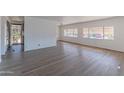 Bright living room with vinyl plank flooring and neutral walls at 2650 W Union Hills Dr # 236, Phoenix, AZ 85027