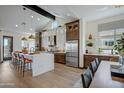 Gourmet kitchen boasts a huge island, custom cabinetry, and high-end appliances at 19980 E El Nido Ln, Litchfield Park, AZ 85340
