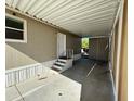 Covered carport area leading to the mobile home entrance at 8832 E Pueblo Ave # 20, Mesa, AZ 85208