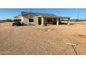 House exterior with covered patio and large backyard at 1527 E Germann Rd, San Tan Valley, AZ 85140