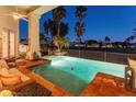 Relax by the inviting pool with comfortable seating and beautiful views at 5843 W Abraham Ln, Glendale, AZ 85308