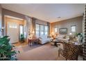 Bright living room with ample seating and large windows at 20377 W Terrace Ln, Buckeye, AZ 85396