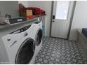 Laundry room with washer and dryer, and patterned floor at 56120 E Riverside Rd, Kearny, AZ 85137