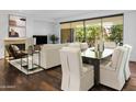 Spacious living area with hardwood floors and balcony access at 7175 E Camelback Rd # 202, Scottsdale, AZ 85251