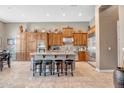 Spacious kitchen featuring an island, stainless steel appliances, and wood cabinets at 41618 N Anthem Ridge Dr, Phoenix, AZ 85086