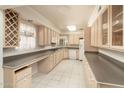 Kitchen with light wood cabinets and granite countertops at 3329 N 17Th Dr, Phoenix, AZ 85015