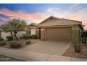 One-story house with a brown garage door and well-maintained landscaping at 43154 N Outer Banks Dr, Anthem, AZ 85086