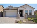 Modern home exterior with gray siding and a white front door at 13190 W Horsetail Trl, Peoria, AZ 85383