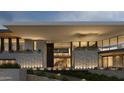 Modern home with a glass entryway and stone exterior at 7150 N 40Th St # 11, Paradise Valley, AZ 85253