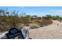 Home entrance with a stone facade and house number at 8876 S Santa Elizabeth Dr, Goodyear, AZ 85338