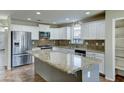 Spacious kitchen with granite island and stainless steel appliances at 34375 N Damietta S Trl, San Tan Valley, AZ 85143