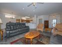 Relaxing living room with comfortable seating and a wood coffee table at 15574 W Vista Grande Ln, Surprise, AZ 85374