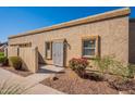 Tan stucco building with a security door and walkway at 1331 E Pierson St, Phoenix, AZ 85014