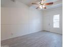 Bright living room with gray tile floors and ceiling fan at 1331 E Pierson St, Phoenix, AZ 85014