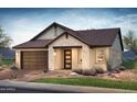 Charming house exterior with stone and tile accents, plus landscaping at 21354 E Sparrow Dr, Queen Creek, AZ 85142